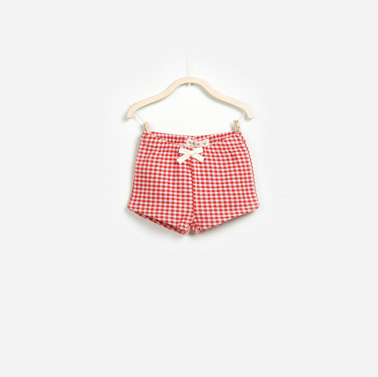 
  Shorts in fantasia vichy della linea abbigliamento bambina Play Up.



  Composizione: 100% Co...