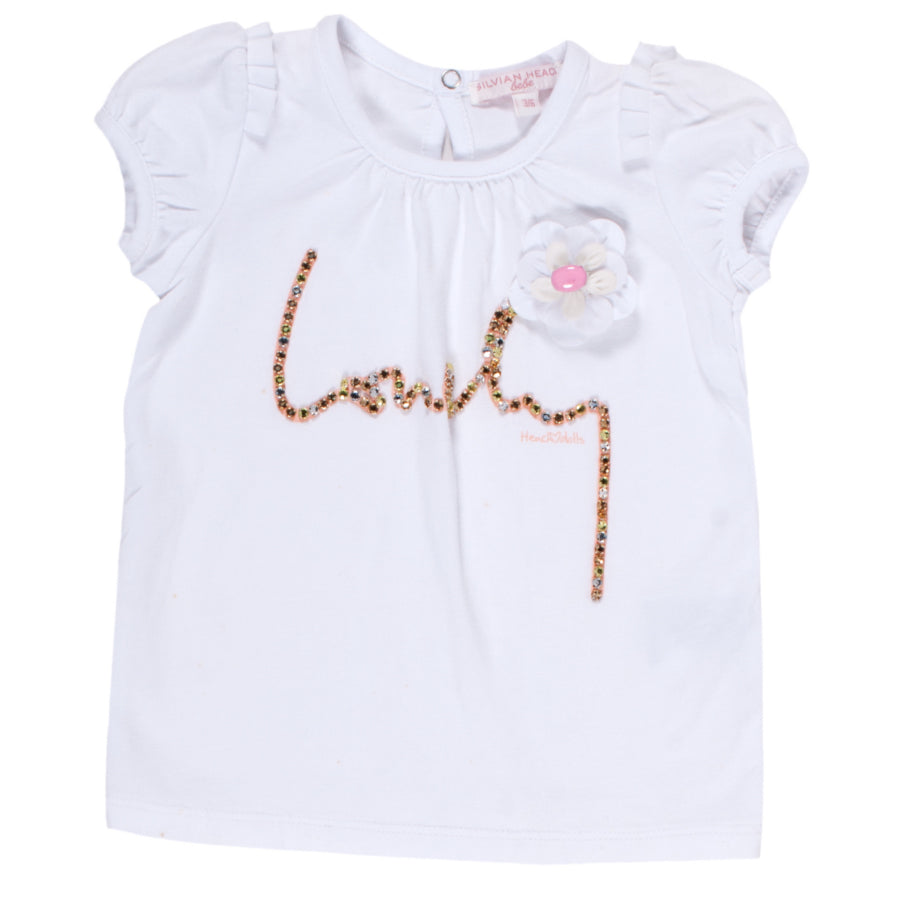 
  Magliettina della linea abbigliamento bambina Silvian Heach Kids; con manichina
  corta a pall...