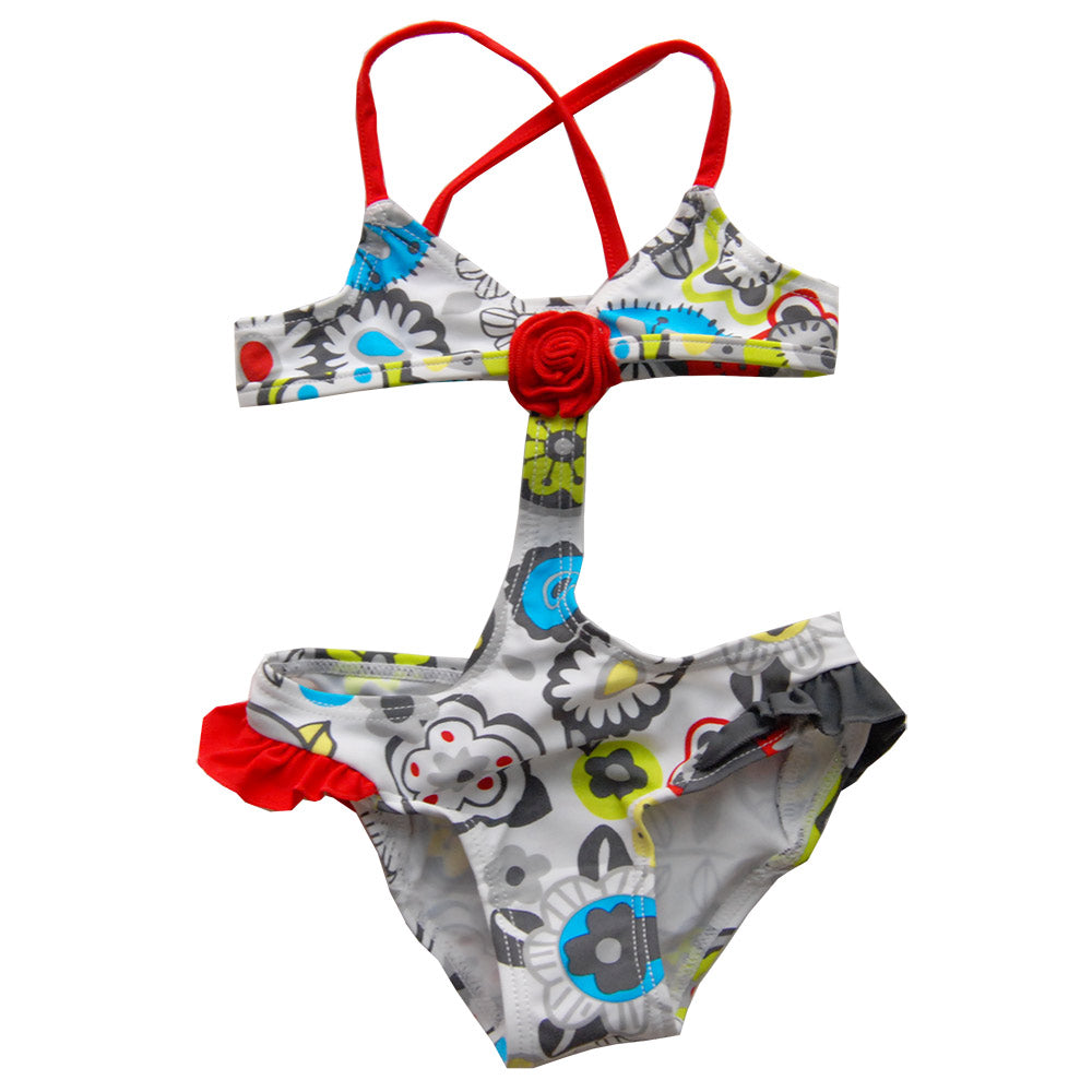 
  Trikini della linea abbigliamento mare bambina Tuc Tuc. Fantasia di fiori multicolor.
  Applic...