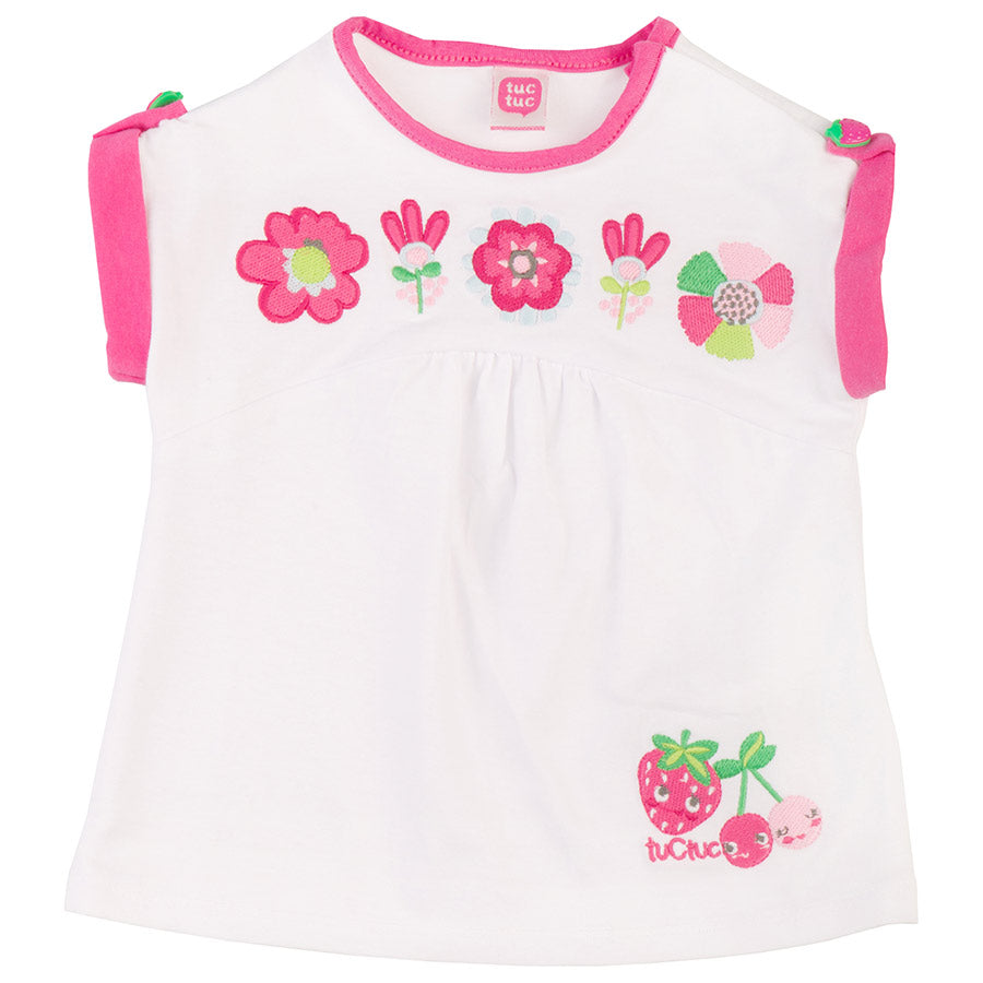 
  T-shirt della linea abbigliamento bambina Tuc Tuc, con manichine raccolte con bottoncino
  e r...